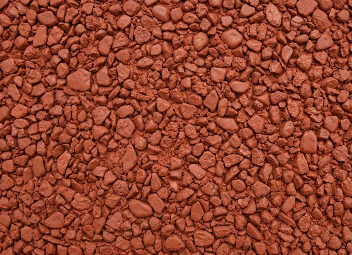 Gros plan du béton désactivé rouge terre battue à Marignane – ACR Provence
